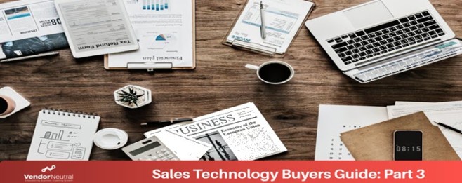 Buyers Guide Sales Technology Implementation Table with computer and documents Blog Feature Image